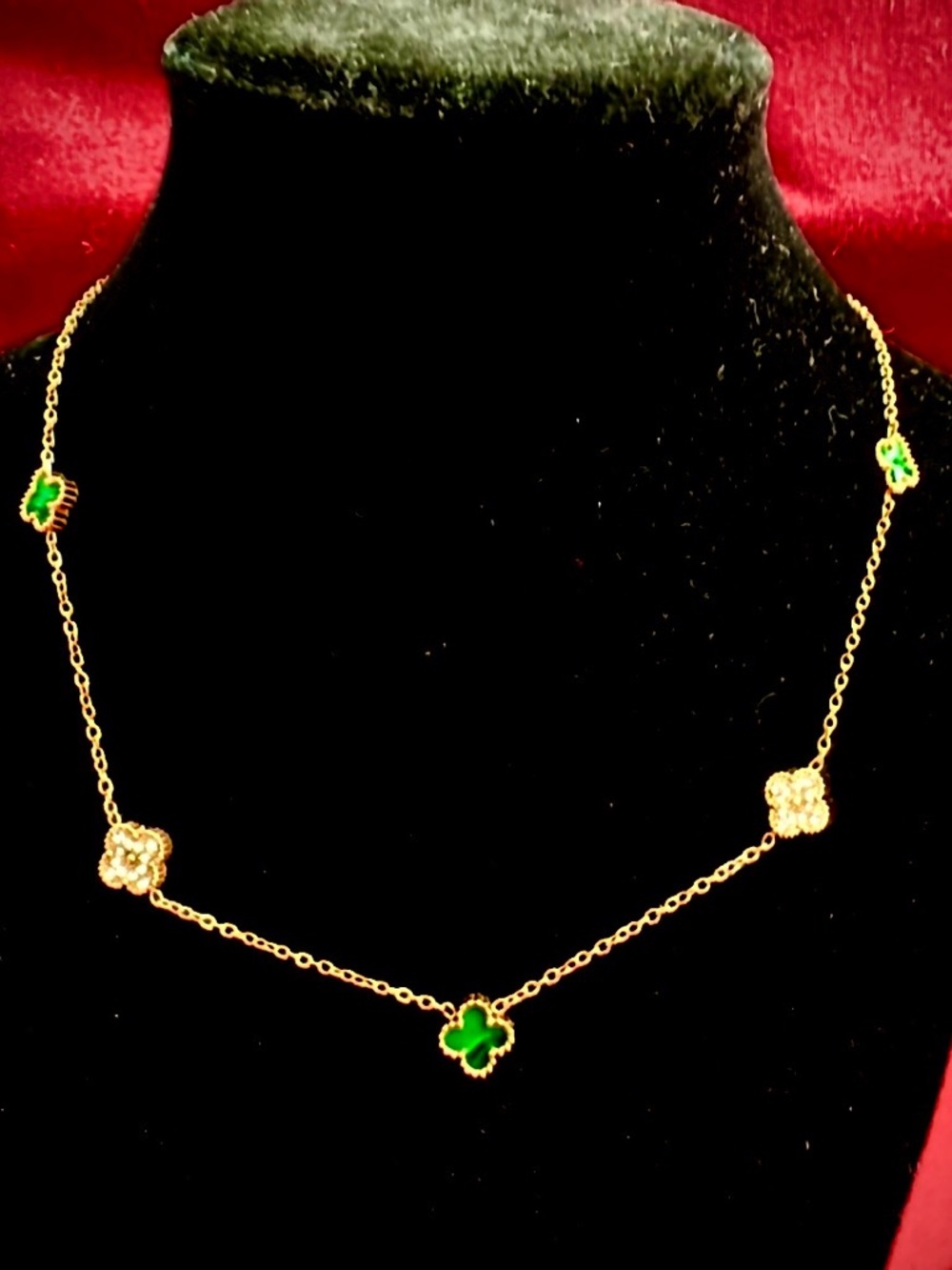 18k plated necklace with five micro clovers in emerald green and pave stones!